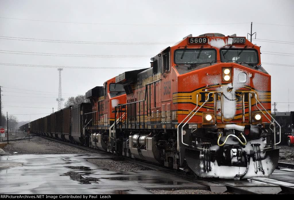 Loaded coal train rolls east